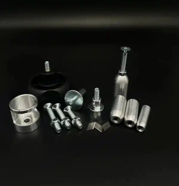 GAEP hull and case trimmer components arranged on a black surface